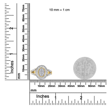 Yellow metal ring with oval cluster of round and baguette white gemstones, shown on ruler and dime for size reference, front-facing angle.