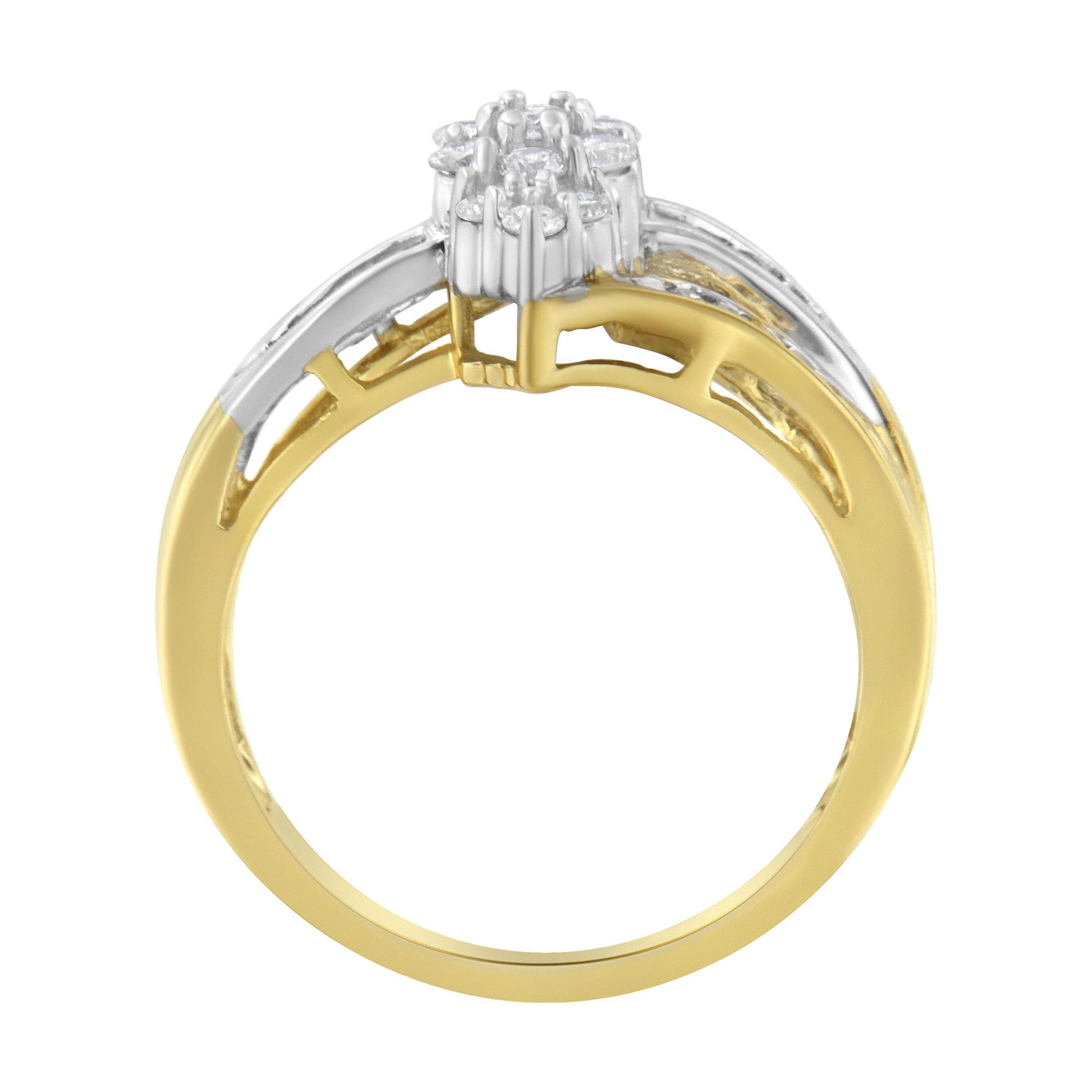 Front angled view of a two-tone ring with yellow and white metal featuring round white gemstones in prong settings and baguette white gemstones in channel settings.