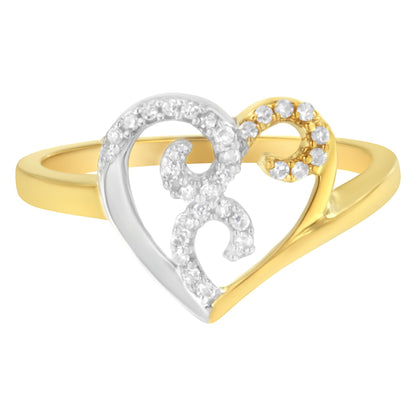 Close-up front angle of a heart-shaped ring with yellow and white metal featuring round white gemstones in a prong setting.