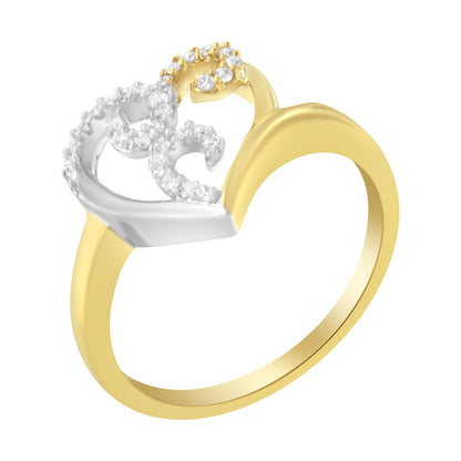 Close-up side angle of a two-tone ring featuring yellow metal band and white metal heart-shaped design adorned with small round white gemstones in prong settings.