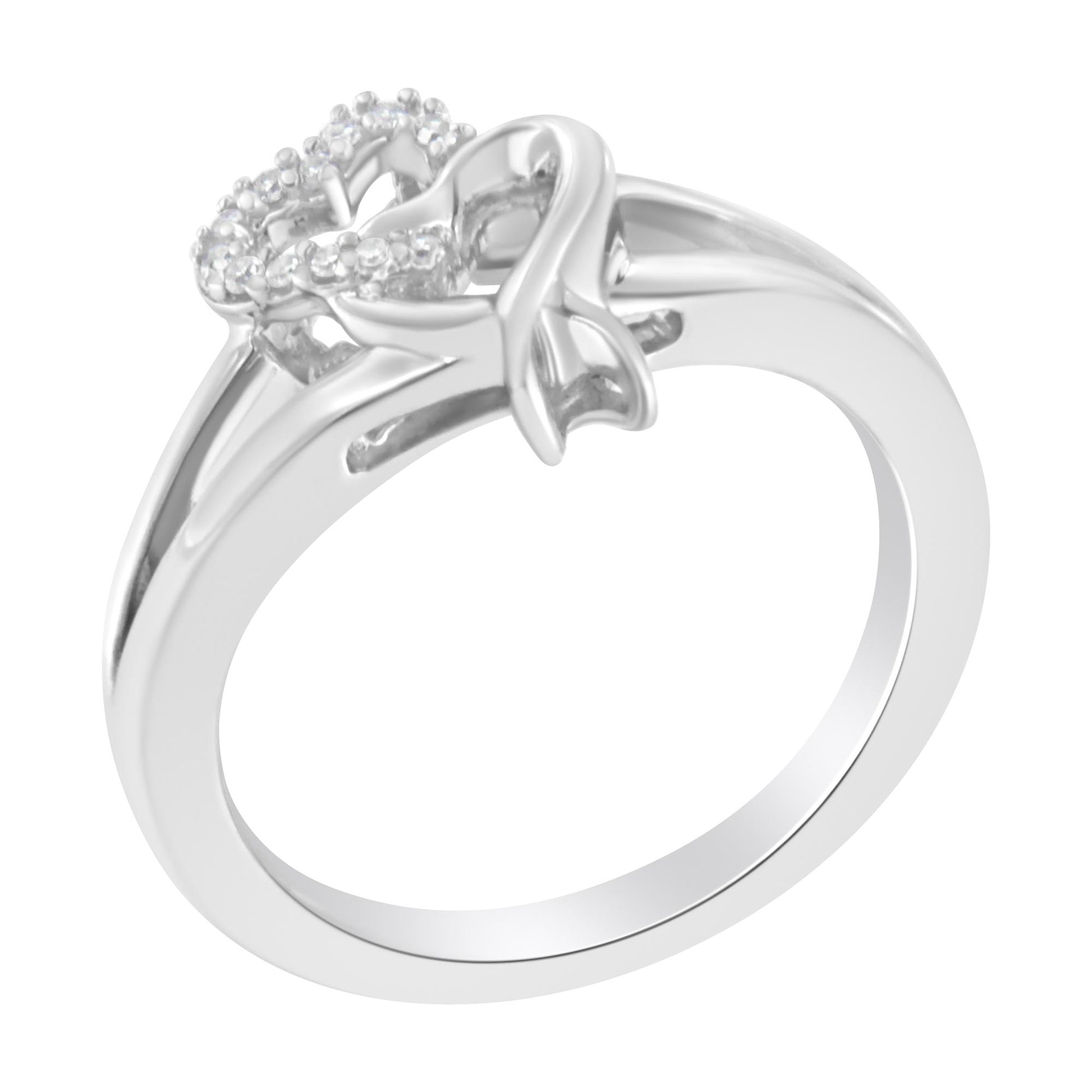 White metal ring with two heart-shaped designs, one outlined with small white gemstones in prong settings, shown at a slight angle.