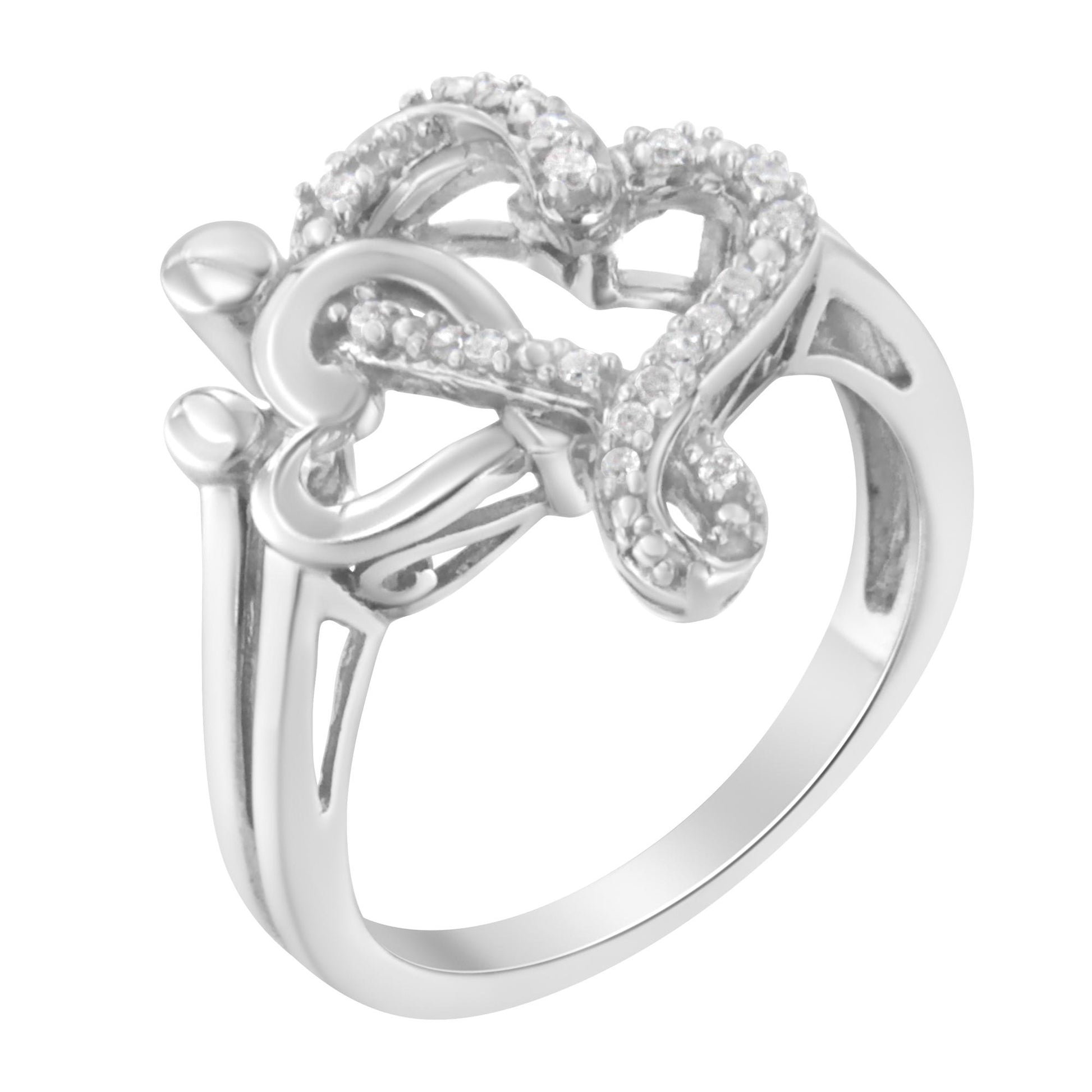 White metal ring with a heart-shaped design featuring round white gemstones in a pave setting, shown from a slightly angled top view.