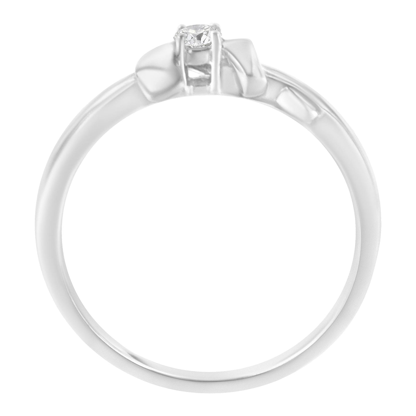Top view of a white metal ring with a single round white gemstone in prong setting.