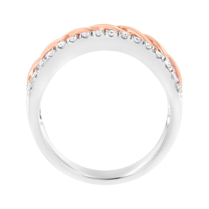 Close-up front view of a two-tone ring with white and rose metal, featuring round white gemstones in prong settings along the top edge.