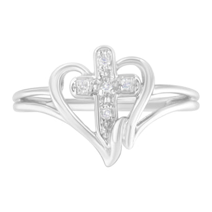 Front angle of a white metal ring with a cross shape adorned with small white gemstones, framed by a heart outline design.