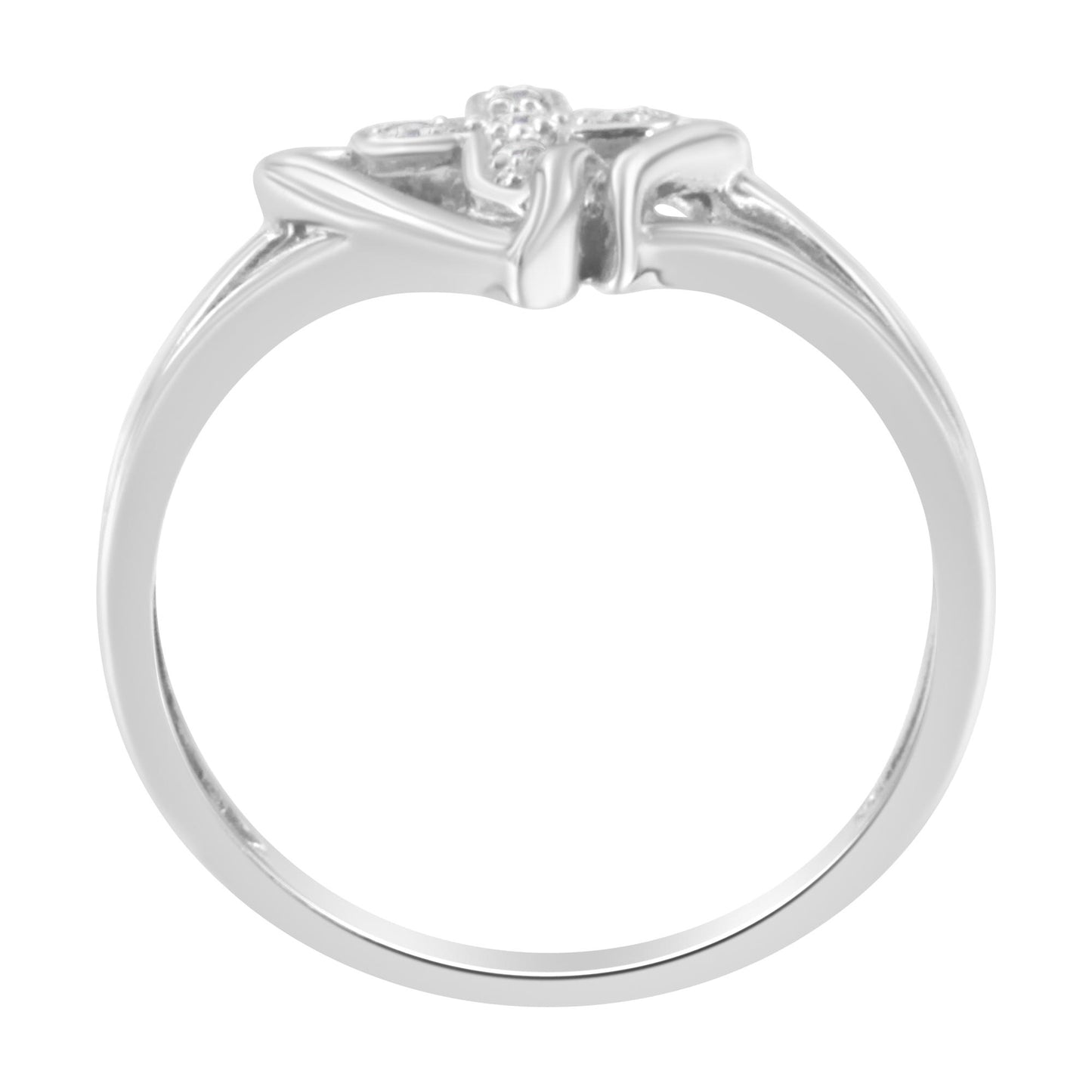 White metal ring viewed from the side, featuring five small round white gemstones in prong settings at the top.