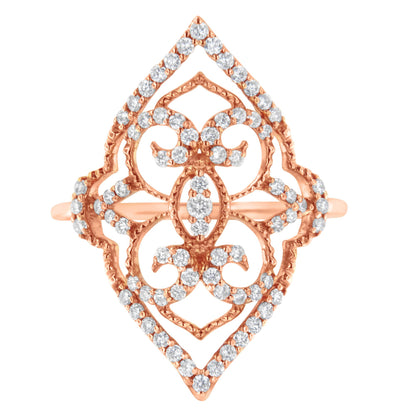 Top-down view of a rose colored metal ring with an openwork design adorned with multiple white round prong-set gemstones.