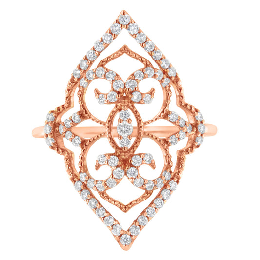 Top-down view of a rose colored metal ring with an openwork design adorned with multiple white round prong-set gemstones.