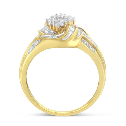 Yellow metal ring with a central cluster of round white gemstones in prong settings, accented by baguette white gemstones in channel settings along the band, shown in a front angle view.