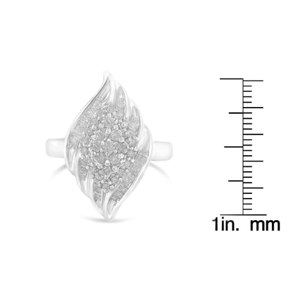 Front view of a white metal ring with a marquise-shaped design featuring two rows of channel-set baguette white gemstones on the sides and a central cluster of prong-set round white gemstones, shown next to a ruler for size reference.