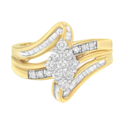 Yellow metal ring with a cluster of round white gemstones in prong settings at the center, flanked by curved rows of channel-set baguette white gemstones, shown from a front angle.