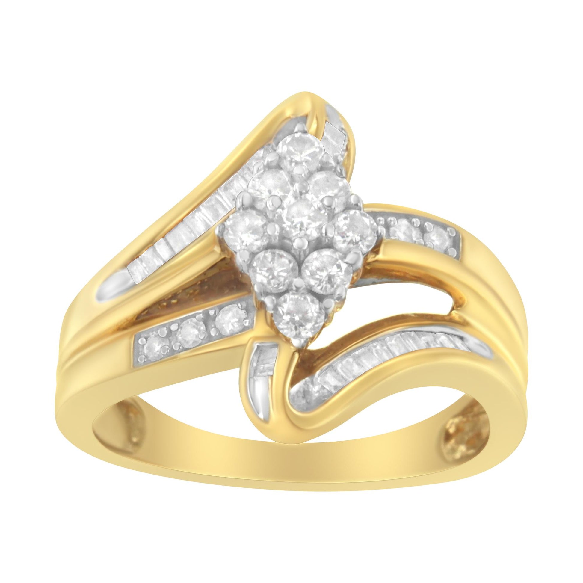 Yellow metal ring with round white gemstones in prong settings forming a cluster at the center and baguette white gemstones in channel settings along the band, shown in a front angled close-up.