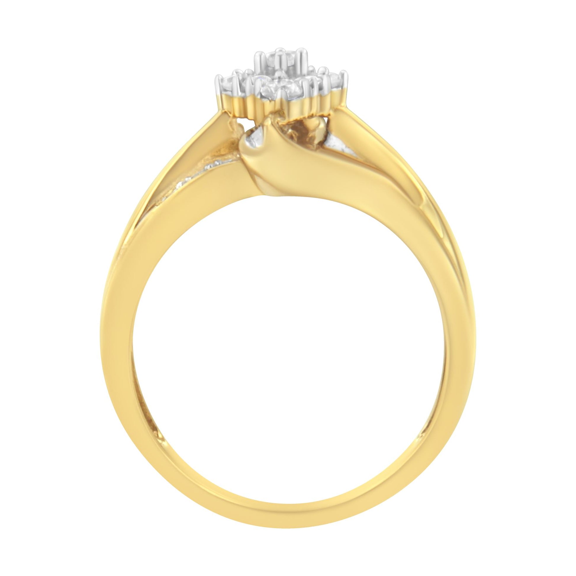 Side view of a yellow metal ring featuring prong-set round white gemstones and channel-set baguette white gemstones.