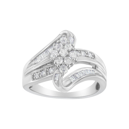 White metal ring with a cluster of round white gemstones in prong settings at the center, surrounded by bands featuring channel-set baguette and smaller round white gemstones, shown from a front angle.