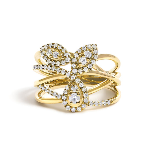 Front close-up of a yellow metal ring featuring an intricate design with multiple intersecting bands adorned with prong-set white round gemstones outlining teardrop and marquise shapes.