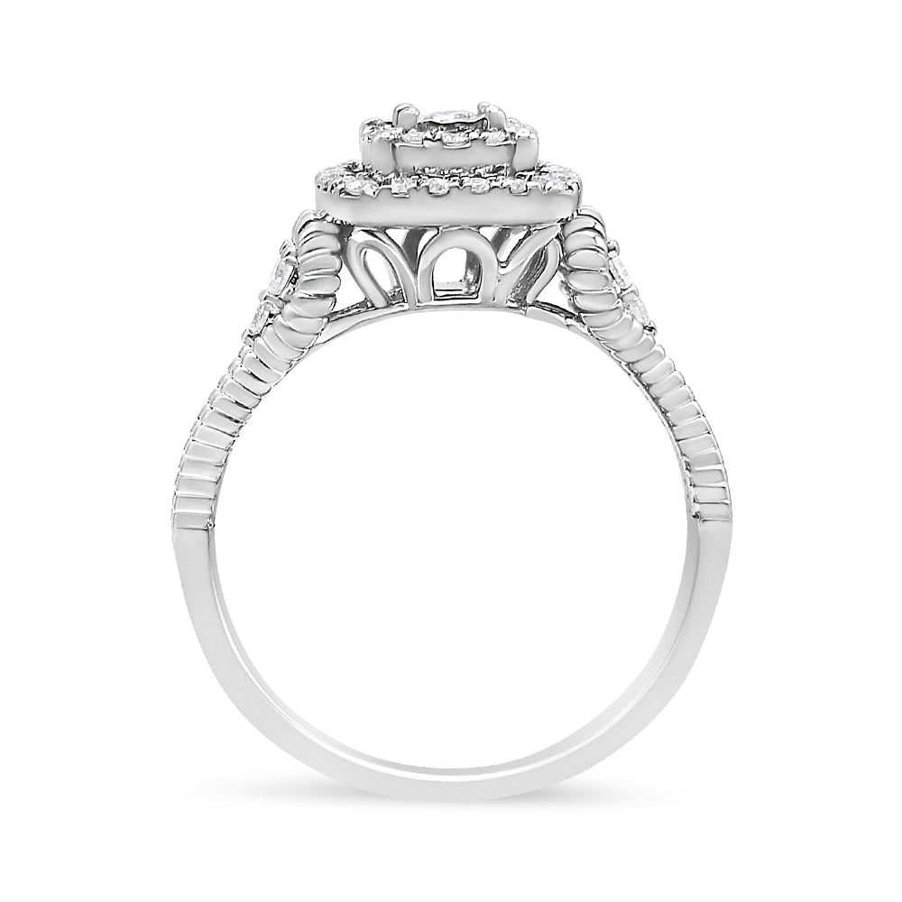Side view of a white ring featuring multiple round white gemstones in prong and miracle settings along the band and around the tiered center.