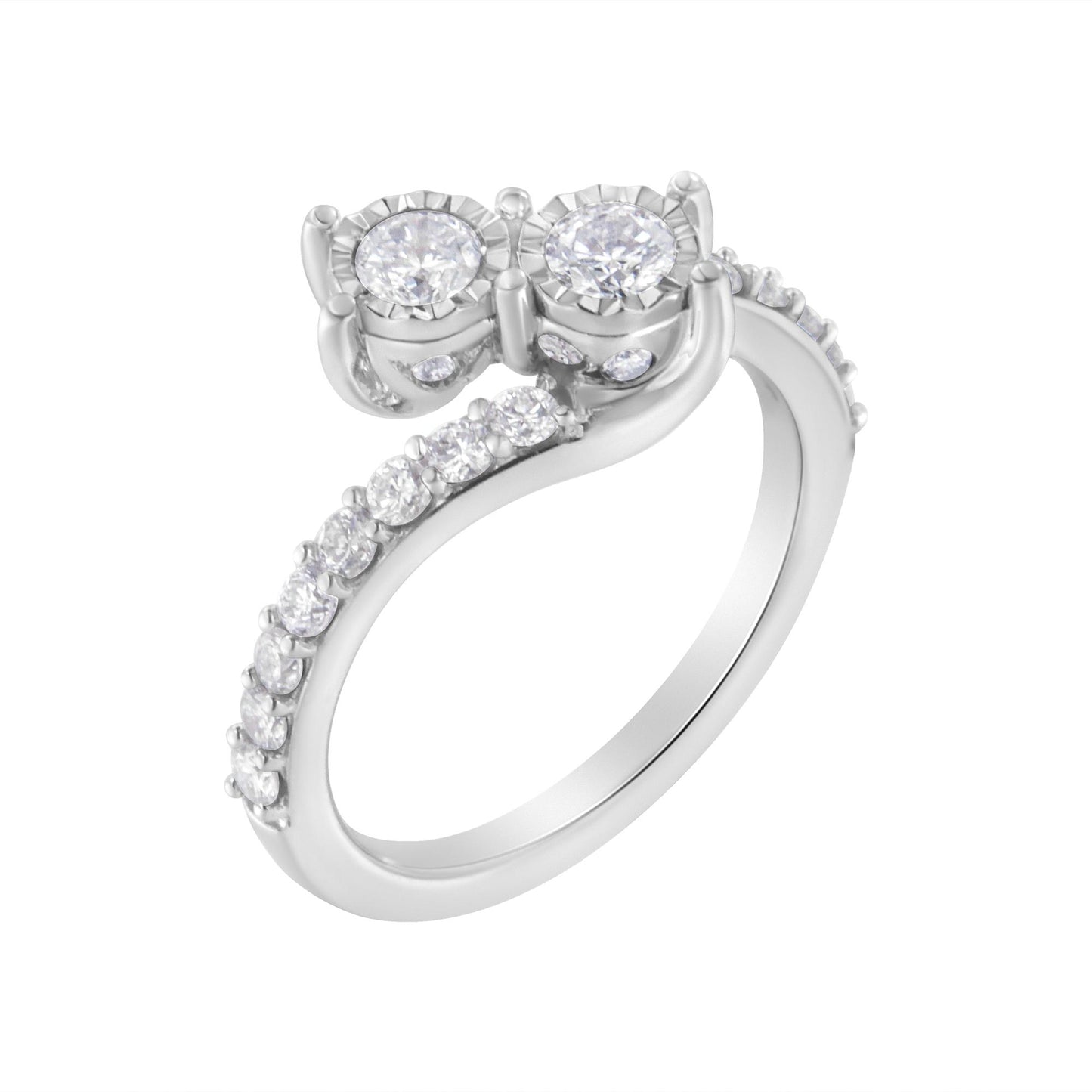 White metal ring viewed from a slight side angle featuring two round white gemstones in miracle settings and multiple smaller round white gemstones in prong settings along the band.
