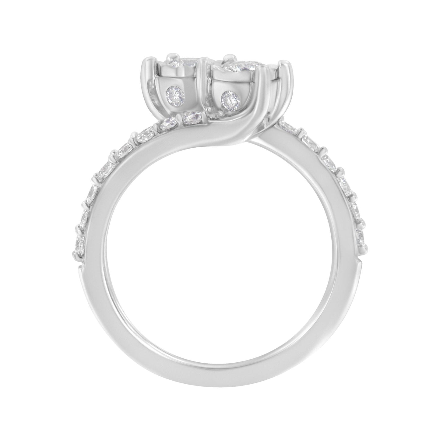 Side angle view of a white metal ring featuring two round white gemstones in a miracle setting and additional round white gemstones in prong settings along the band.