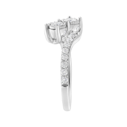 Side view of a white metal ring featuring two round white gemstones in miracle settings at the top and multiple smaller round white gemstones in prong settings along the band.