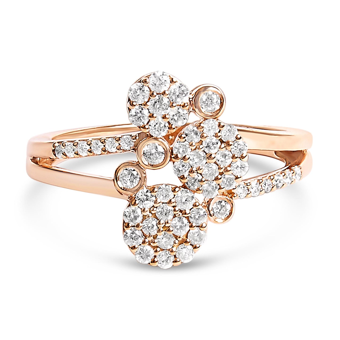 Close-up front angle of a rose metal ring with clusters of round white gemstones in prong settings, featuring multiple circular arrangements on the band.