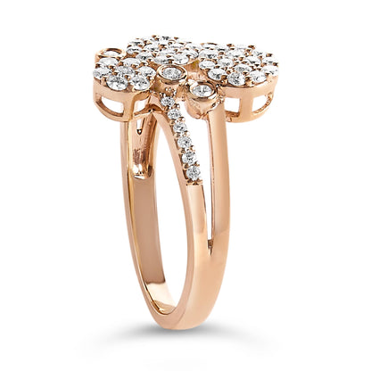 Side angle view of a rose metal ring with multiple clusters of round white gemstones in prong settings on the top and along one band.