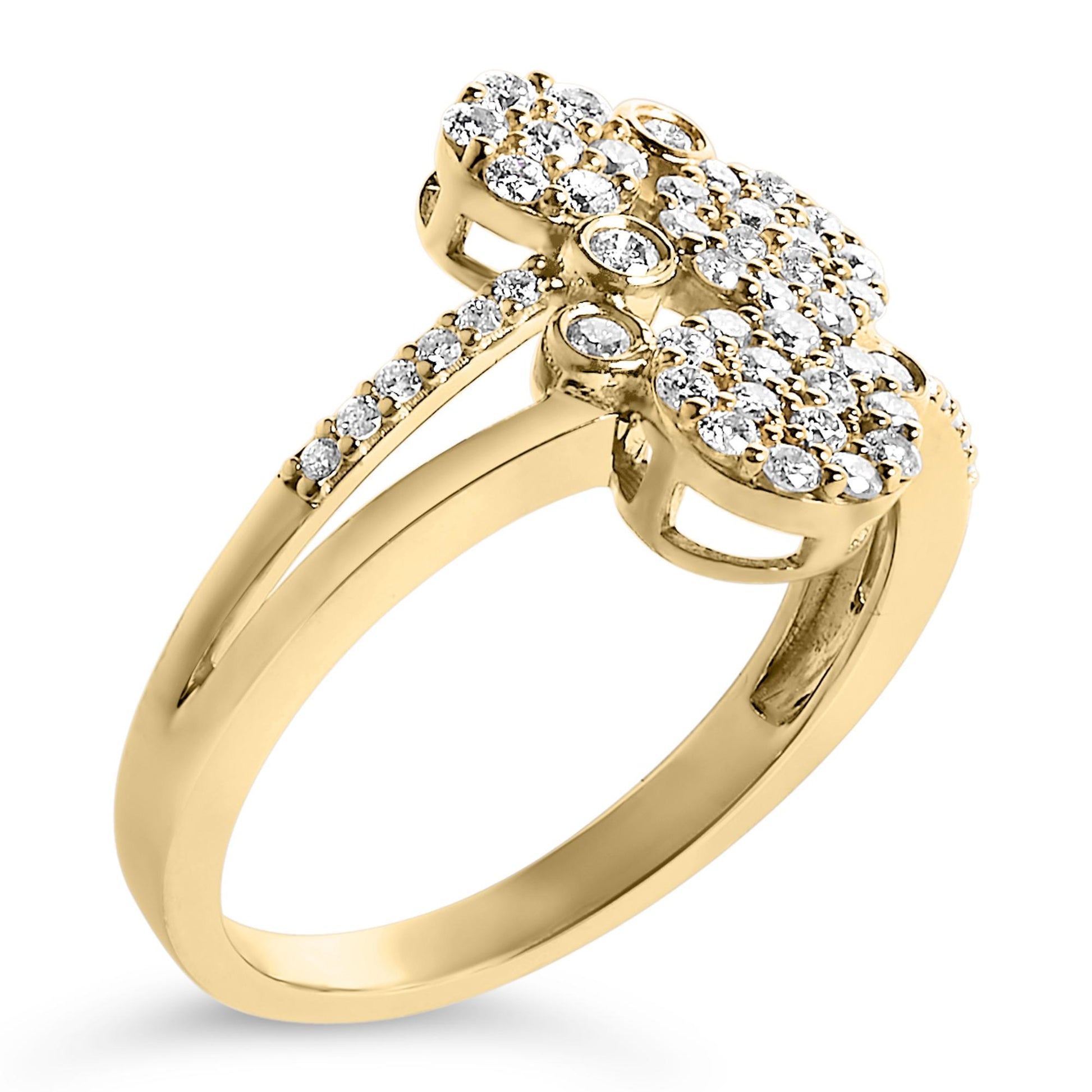 Yellow metal ring with multiple clusters of white round gemstones in prong settings, shown at a slight angle.