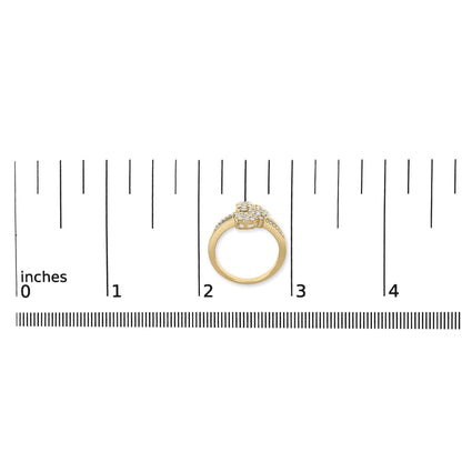 Yellow ring with multiple white round gemstones in prong settings, shown from a top front angle on a ruler for size reference.