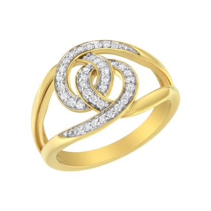 Yellow metal ring with intertwined design adorned with round white gemstones in pave setting, viewed from a slightly angled top perspective.