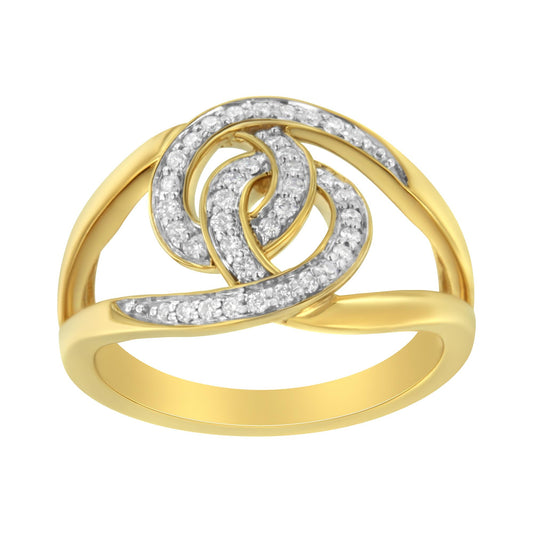 Front-facing view of a yellow metal ring with an openwork design featuring curved bands paved with white round gemstones.