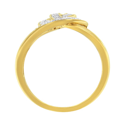 Side view of a yellow metal ring with round white gemstones in pave settings along the top band.