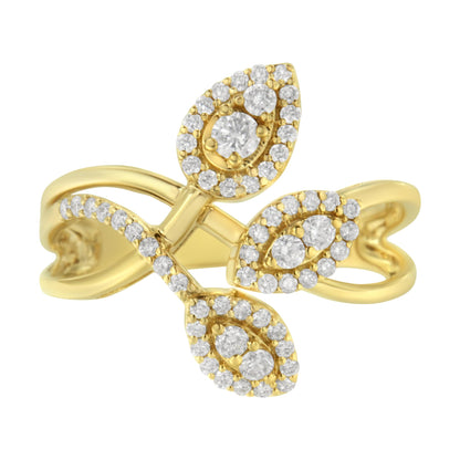 Close-up angled view of a yellow metal ring featuring three leaf-shaped clusters of round white gemstones with prong settings, surrounded by smaller round white gemstones on the band.