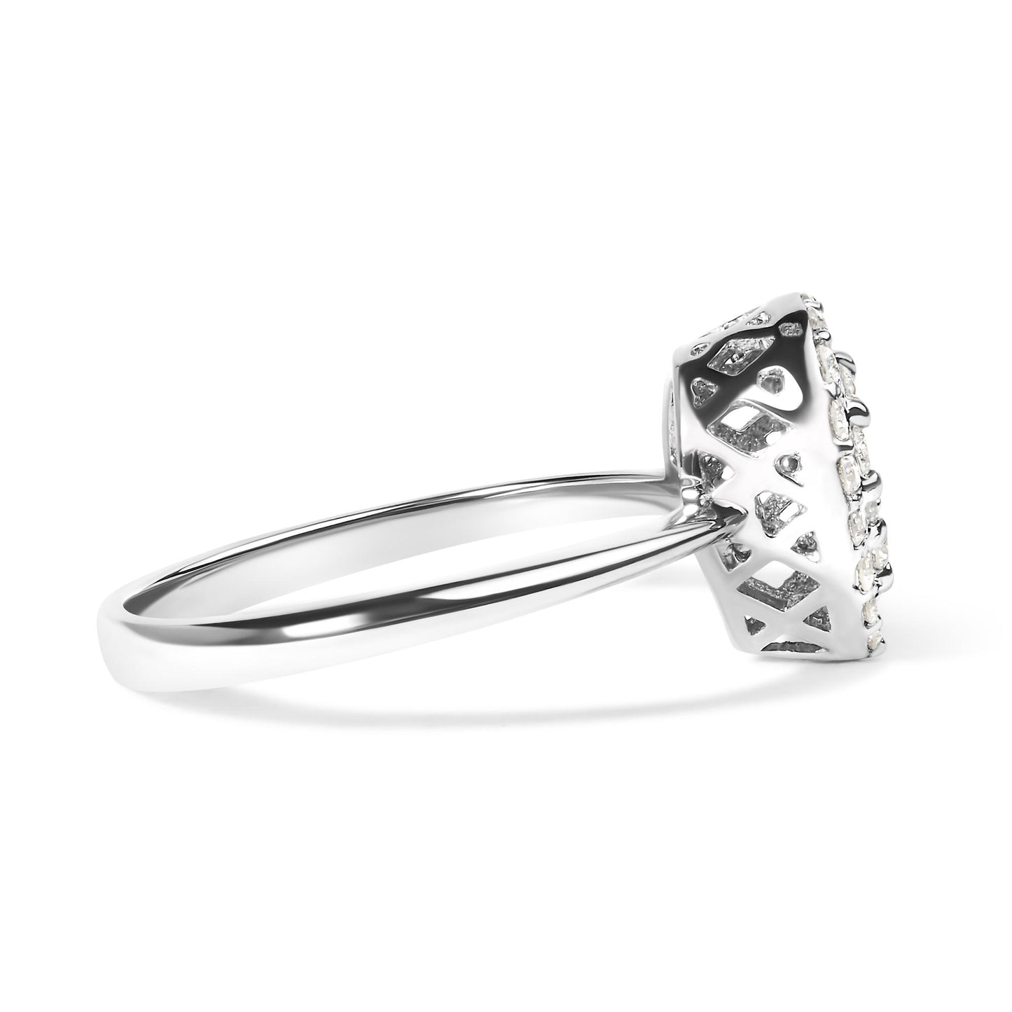 Side view of a white metal ring with a raised setting featuring multiple round white gemstones in prong settings.