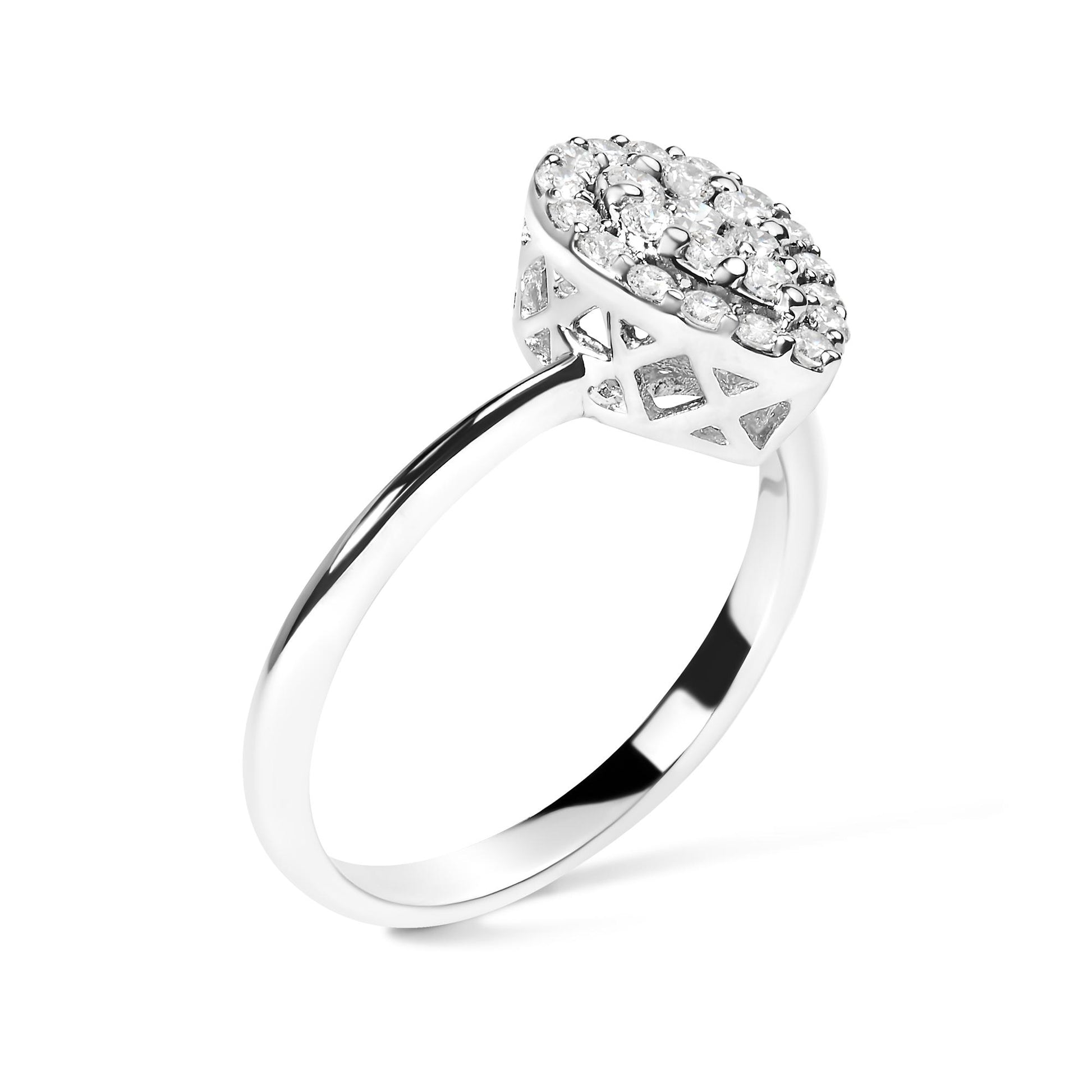 White metal ring with cluster of round white gemstones in prong setting, shown in side angled view.