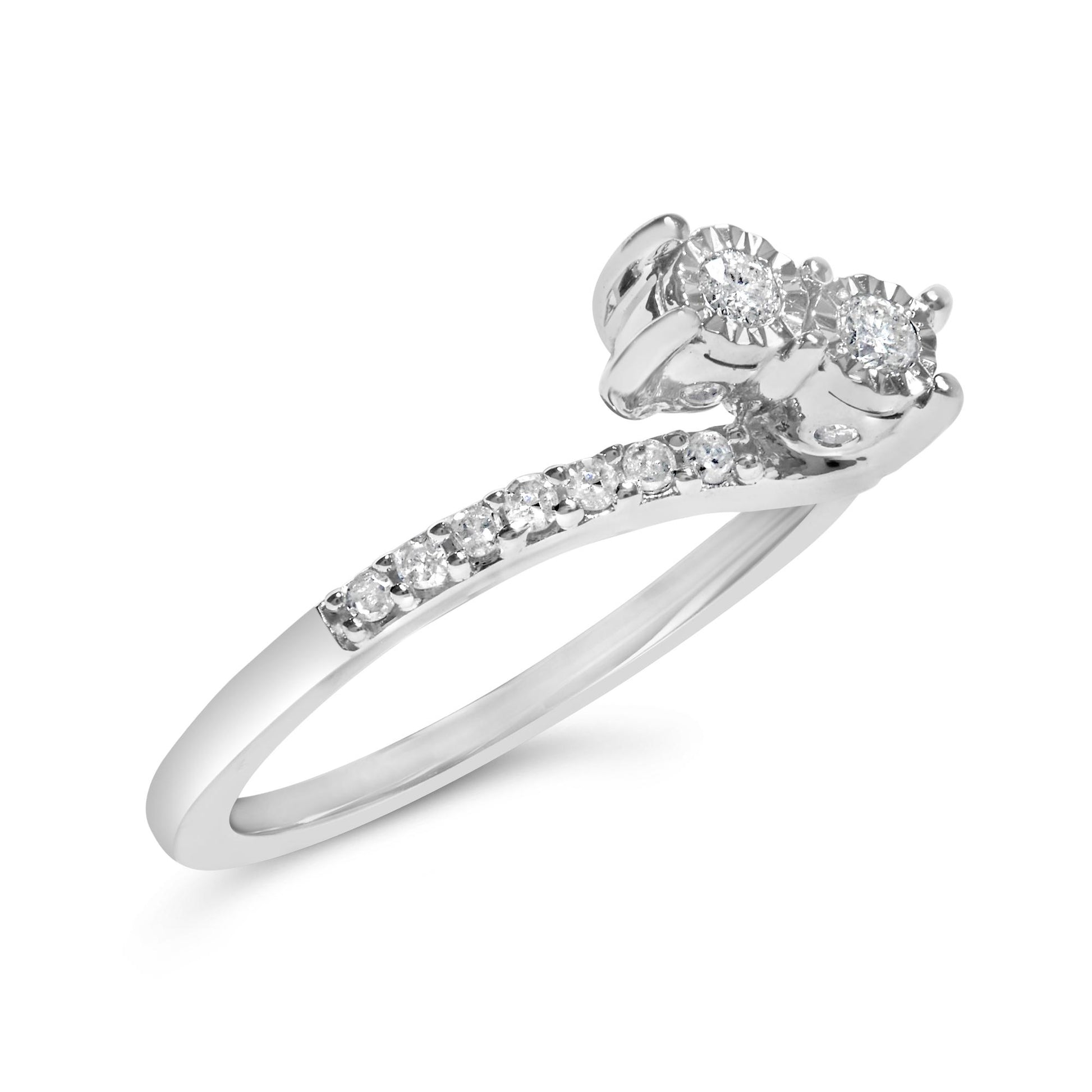 Close-up angled view of a white metal ring featuring two round white gemstones in miracle settings and a row of smaller round white gemstones in shared prong settings along the band.