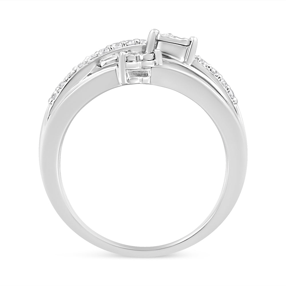 White metal ring with round white gemstones in miracle and prong settings, shown from side angle.