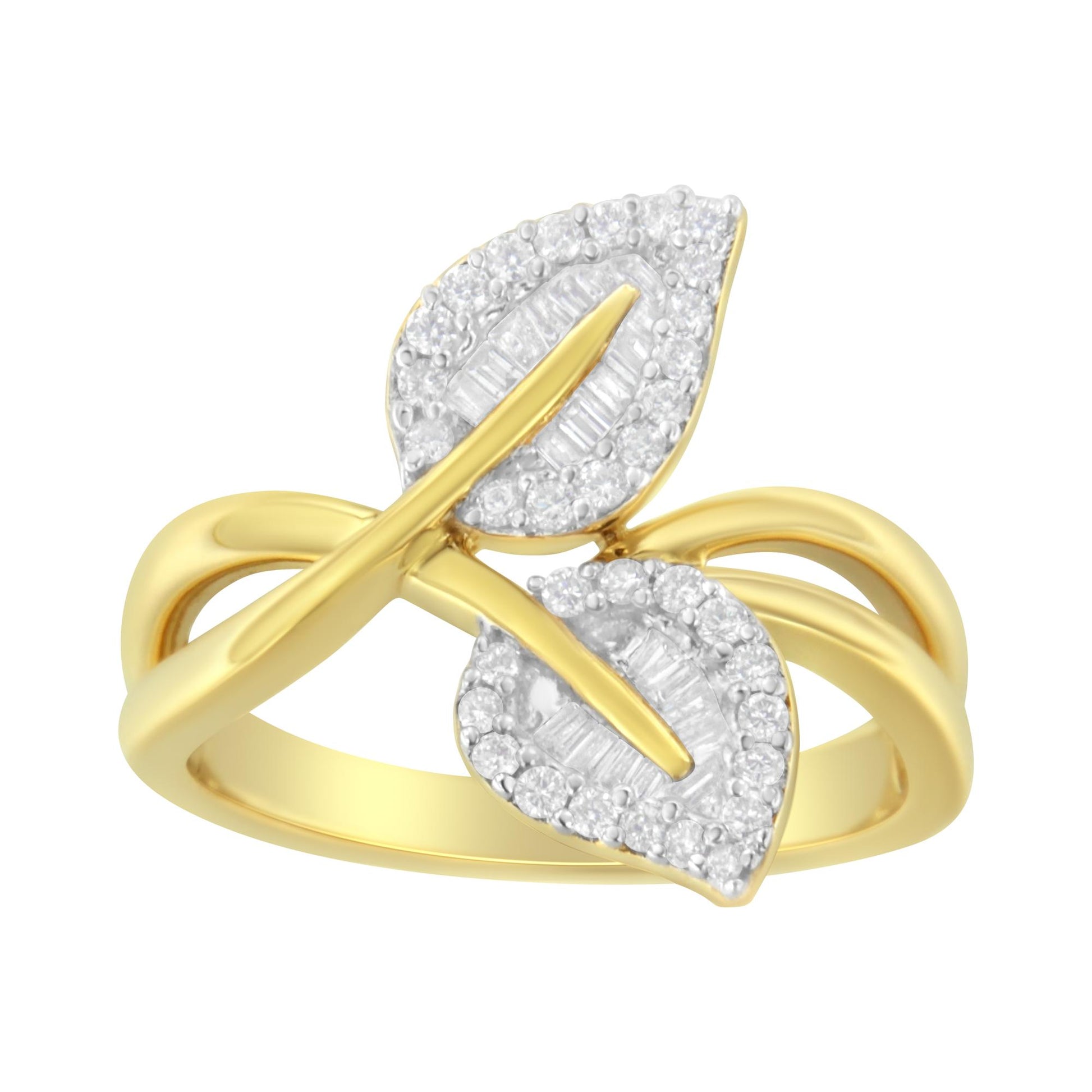 Yellow metal ring with a crossover band design, featuring two leaf-shaped elements adorned with white round and baguette-shaped gemstones, shown in a front angle view.