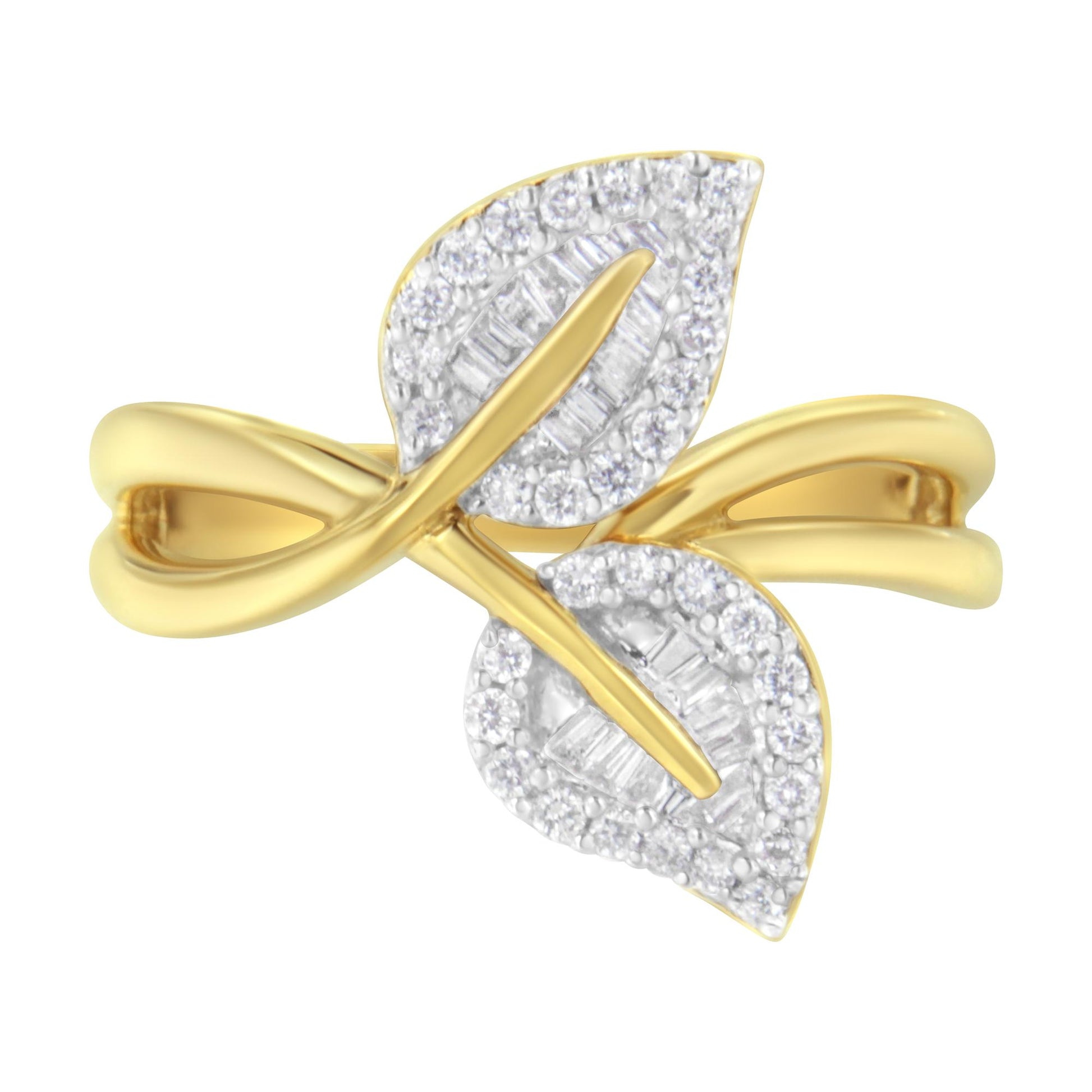 Top-front angle of a yellow ring featuring two leaf-shaped sections adorned with round prong-set white gemstones around the edges and baguette channel-set white gemstones in the centers.
