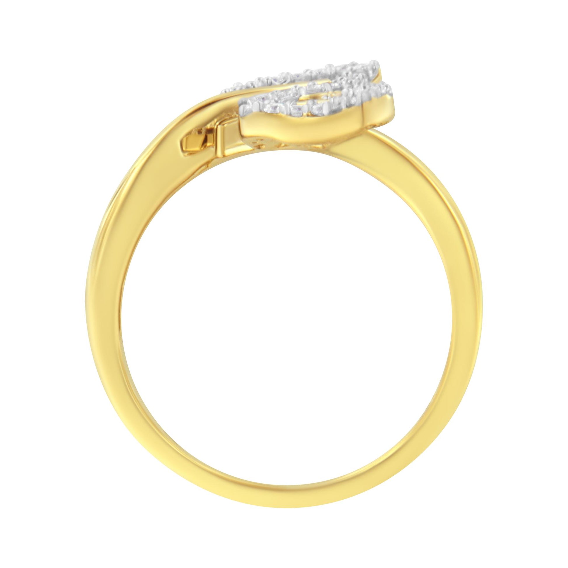 Side view of a yellow metal ring with white round gemstones in prong setting and white baguette gemstones in channel setting on top.