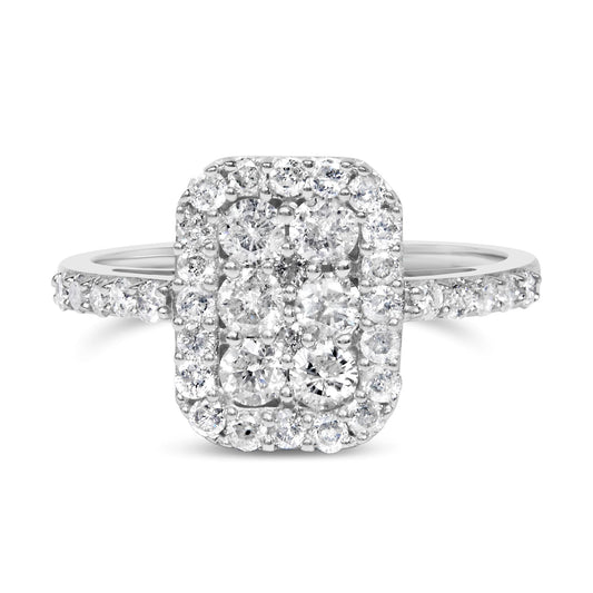 Front-facing close-up of a white metal rectangular ring featuring clustered round white gemstones in prong settings with additional smaller gemstones around the center and along the band.