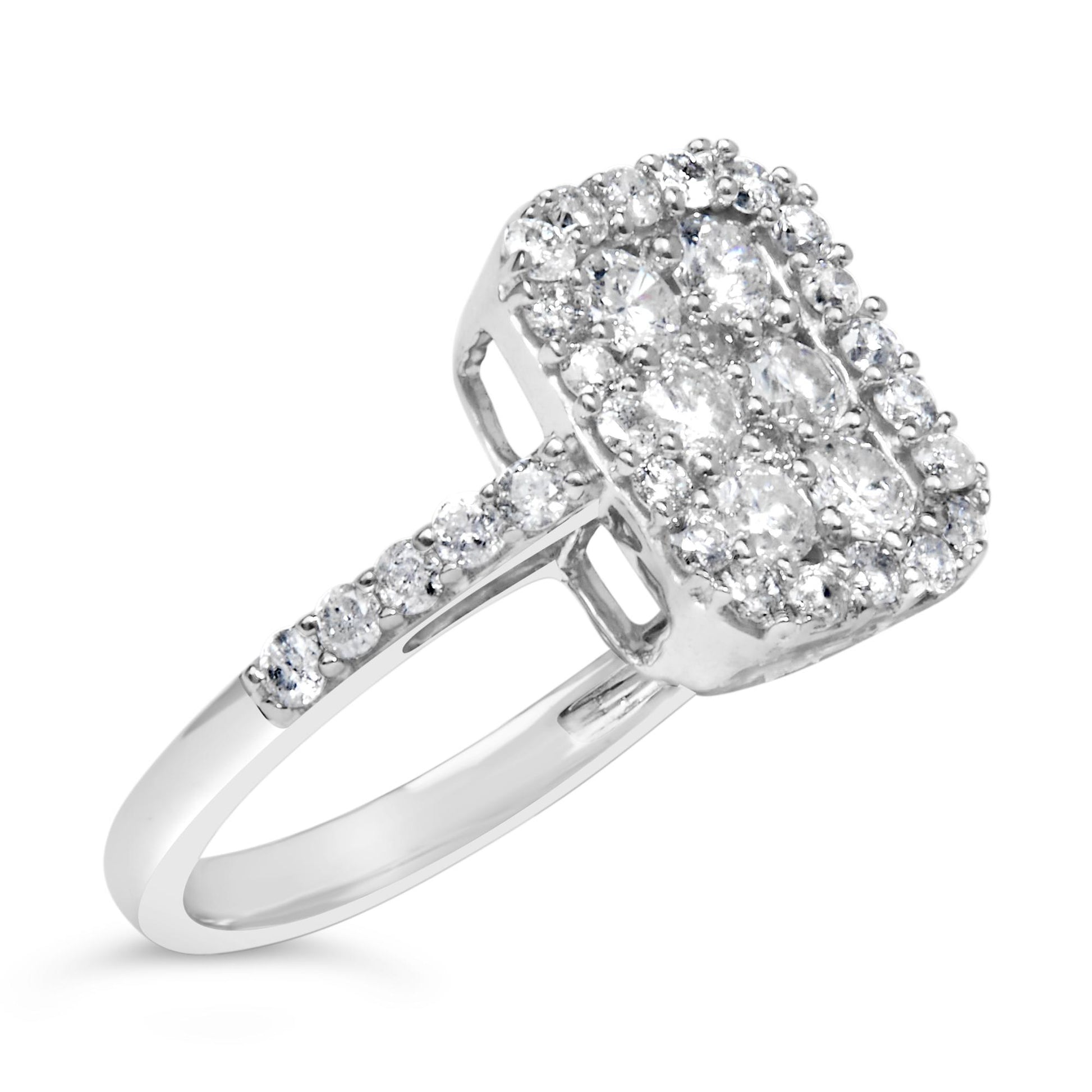Ring with white metal band featuring a rectangular cluster of prong-set round white gemstones, side view at an angle.