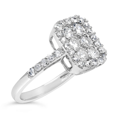 Ring with white metal band featuring a rectangular cluster of prong-set round white gemstones, side view at an angle.