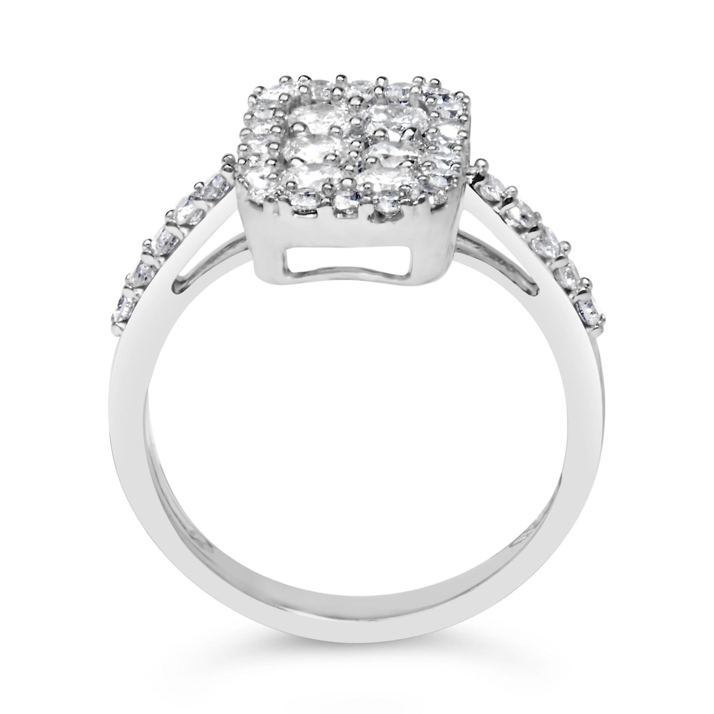 Front-facing close-up of a white metal ring with a square cluster of round white gemstones in prong settings on top and additional round white gemstones set along the shoulders.