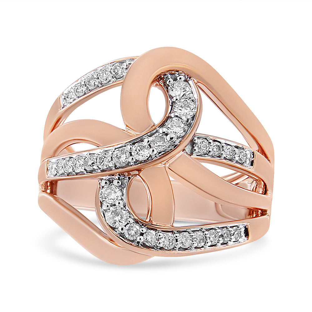 Rose metal ring with intertwined, curving bands accented by multiple small white gemstones, shown from a front angle.