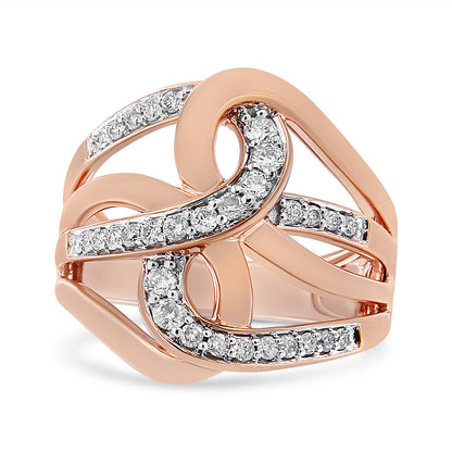 Rose metal ring with intertwined, curving bands accented by multiple small white gemstones, shown from a front angle.