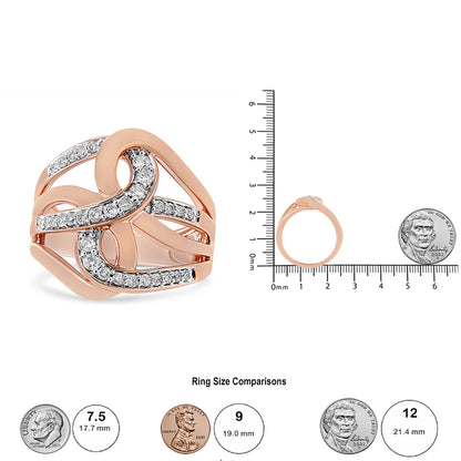Rose-colored ring with twisting bands partially set with round white gemstones in prong settings, shown from front angle and side angle on a ruler with coins for size reference.