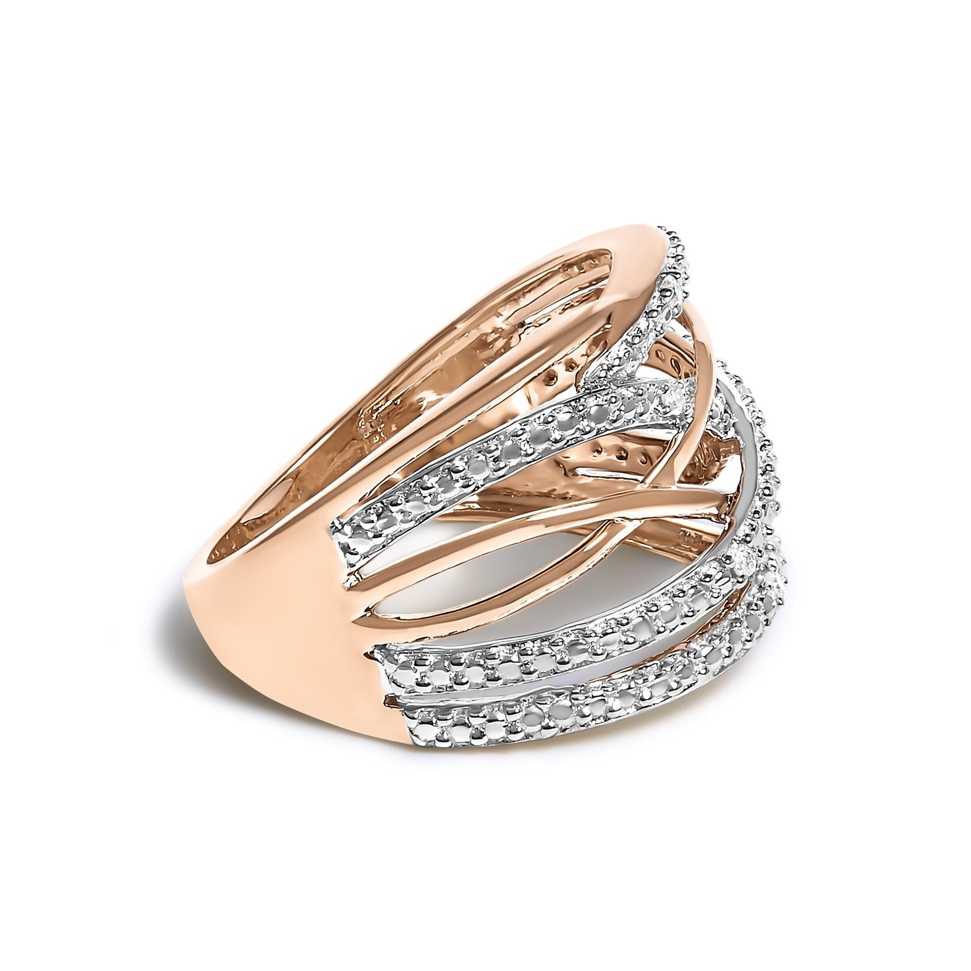 Rose metal ring with multiple crisscrossing bands accented with white gemstones in pave setting, shown at an angled side view.