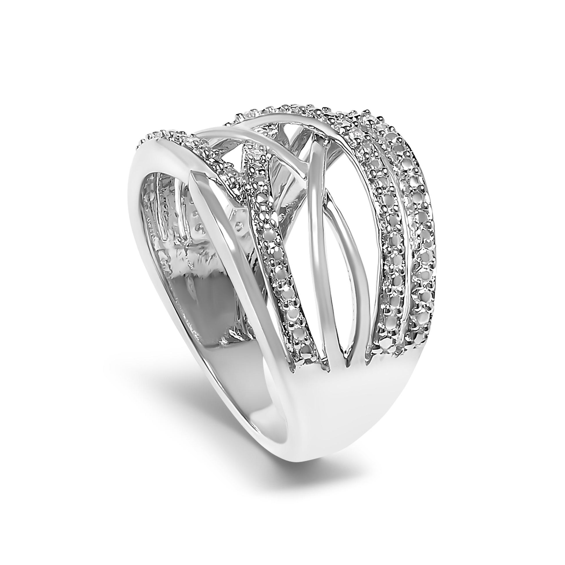 White metal ring with multiple overlapping bands, some adorned with white round pave-set gemstones, shown at an angled close-up view.