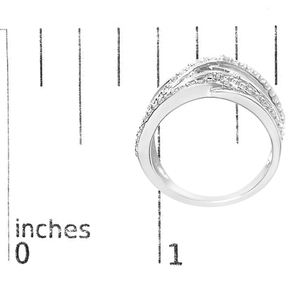 White metal ring with curved bands and pave set round white gemstones, shown on a ruler for size reference, side view.