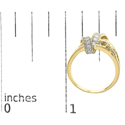 Yellow metal ring with two rows of round white gemstones in pave setting, shown from side angle on a ruler for size reference.
