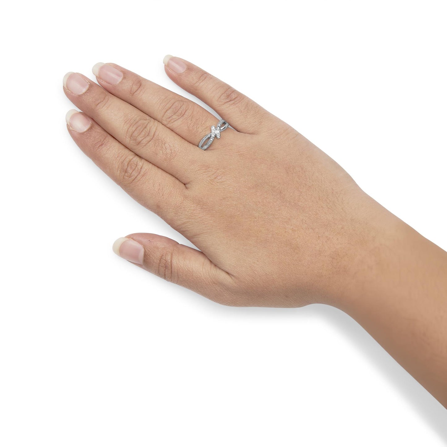 White metal ring with round white gemstones in prong settings forming an intertwined design, worn on a model's hand, angled top-down.